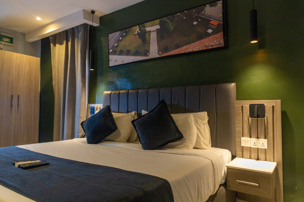 Accommodation Types 1 standar room ikogosi resort bed side view