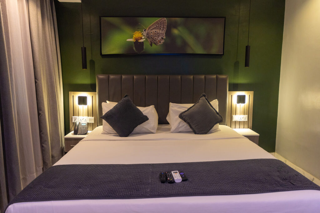 Accommodation Types 3 superior room ikogosi resort bed front view